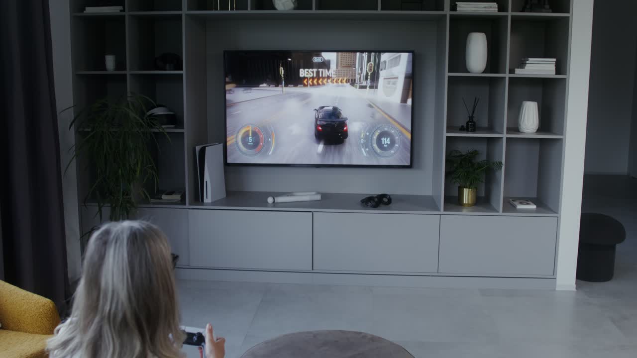 Woman playing a video game on TV
