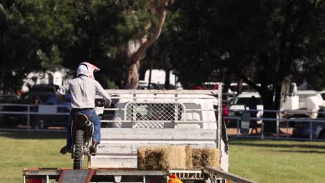 motorcyclist performing stunts for an audience