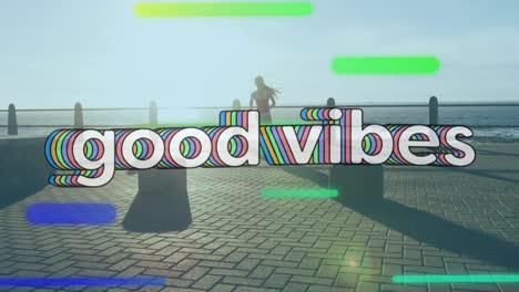 animation of words good vibes over woman jogging on promenade by the sea