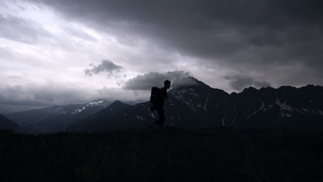 hiker in the mountains during a storm