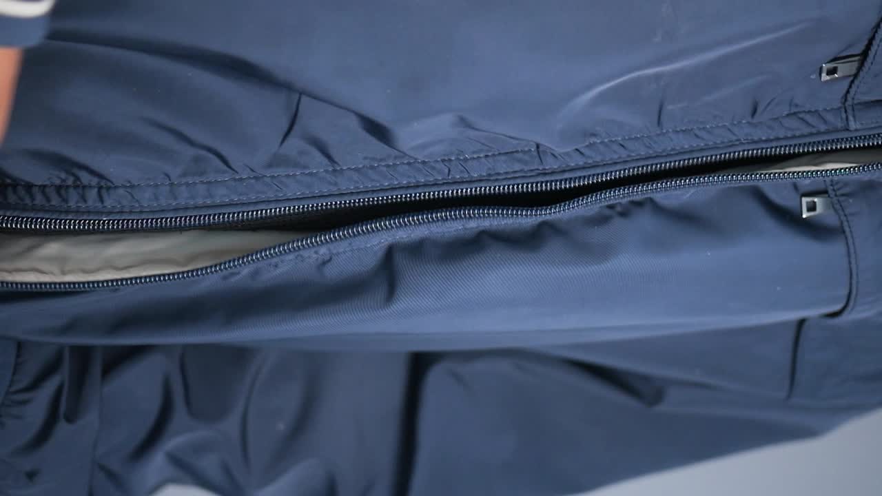 Close-up of a zipper on blue fabric