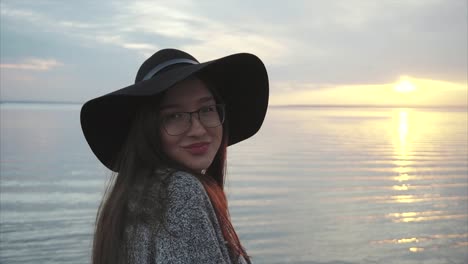 woman at sunset by the lake