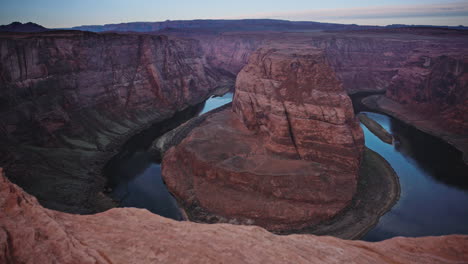 Pan-across-river-valley-with-red-rock-canyon