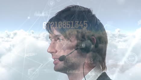 animation of network and data processing over businessman using phone headset, over cloudy sky