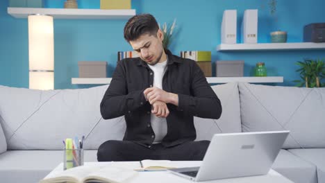 young man with wrist and back pain feeling tired.