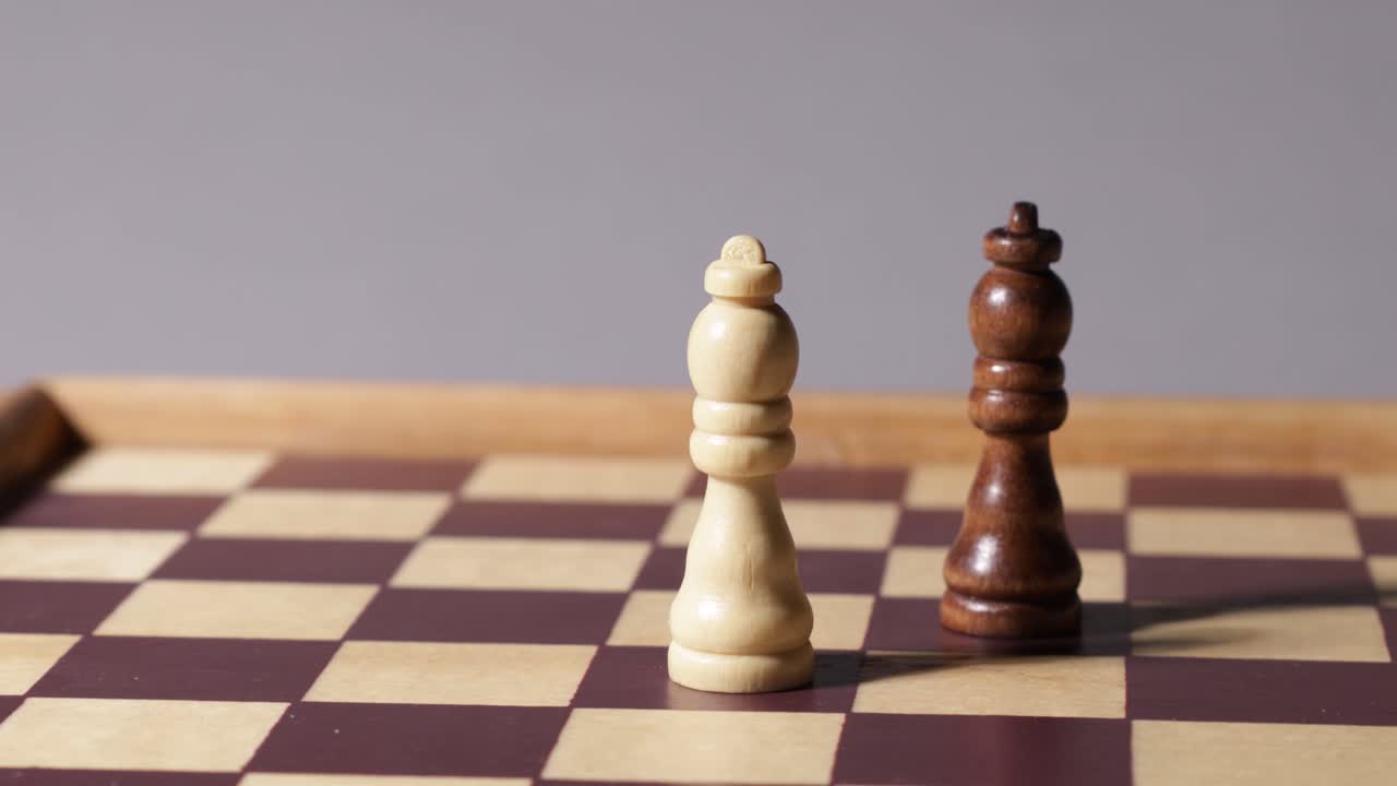 Cinematic shot moving around chessboard with queens