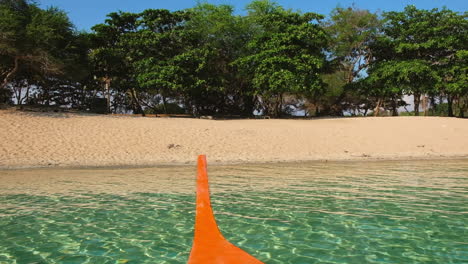 Orange-Boat-Coming-Into-Hermana-Menor-Island,-Zambales,-Philippines