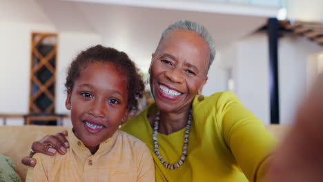 face, smile and selfie of kid with grandmother
