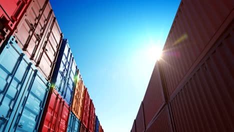 beautiful scene of rows of cargo shipping metal containers in warehouse under the sun seamless. looped 3d animation of endless abstract container boxes.