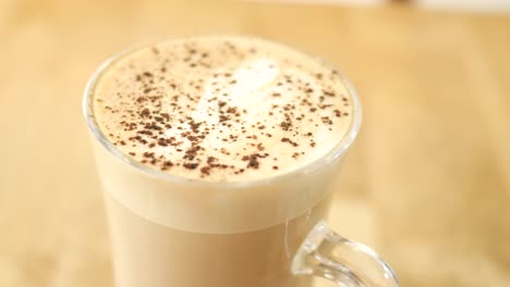 A-cup-of-late-coffee-with-flower-shape-design-on-top-at-cafe