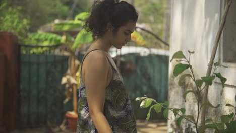 Natural-Beauty-Indian-Girl-Looking-at-Camera,-Outdoor-Rural-Home,-Slow-Motion