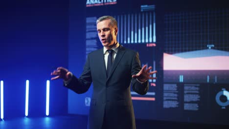 successful businessman answering questions during seminar