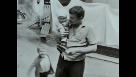 soviet man holding baby, a touching video portraying parenthood in the ussr archive. circa ussr 1980s: a heartwarming video capturing a soviet man embracing a baby, showcasing the strong bond of family in the soviet union.