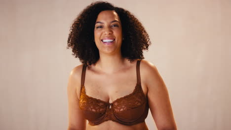 studio portrait shot of smiling confident natural woman in underwear promoting body positivity