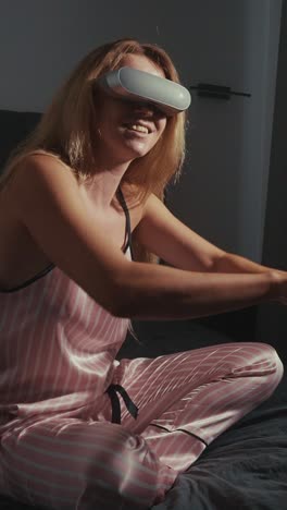 woman wearing vr headset in pajamas