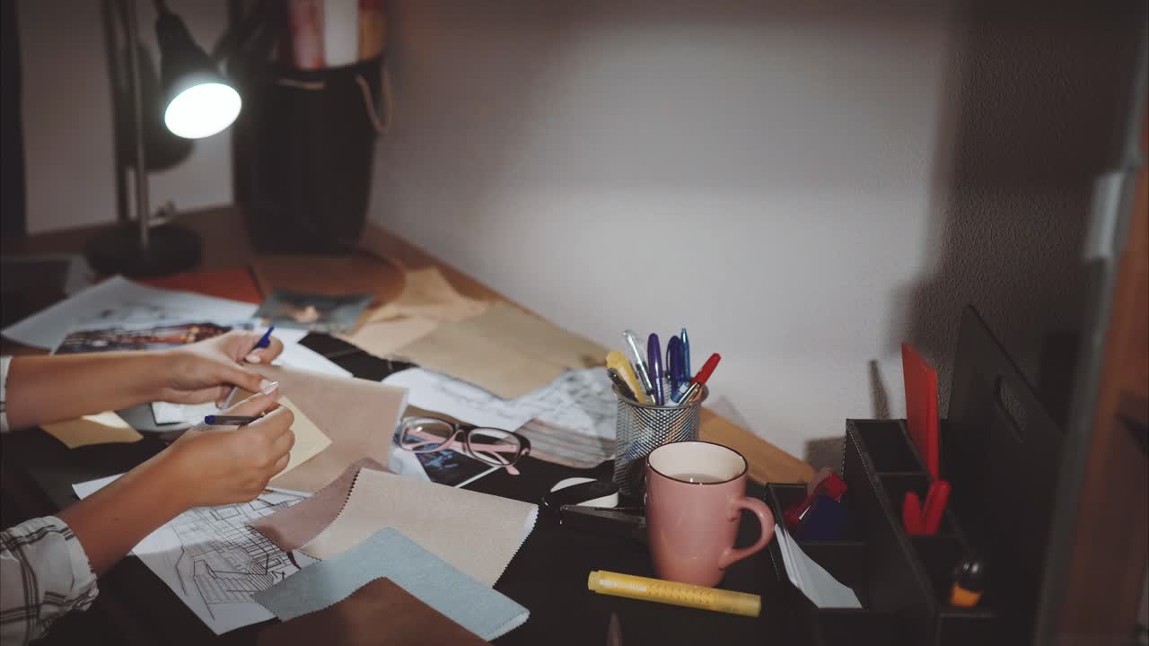 Interior Designer at Work at Night