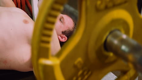 man lifting a heavy barbell