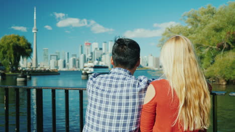 couple admire toronto skyline