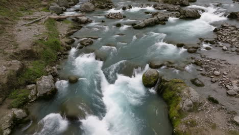river rapids with rocks and clear water