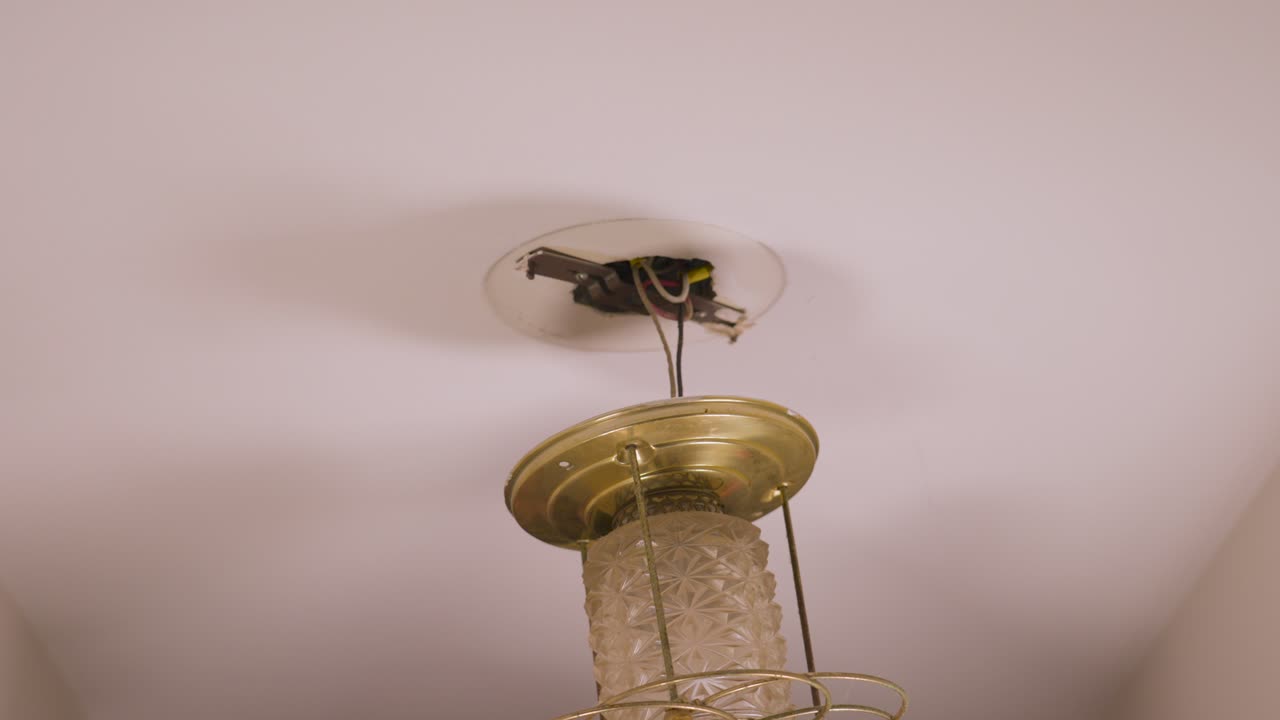 Pulling down the bundle of connected ground, hot, and neutral wires