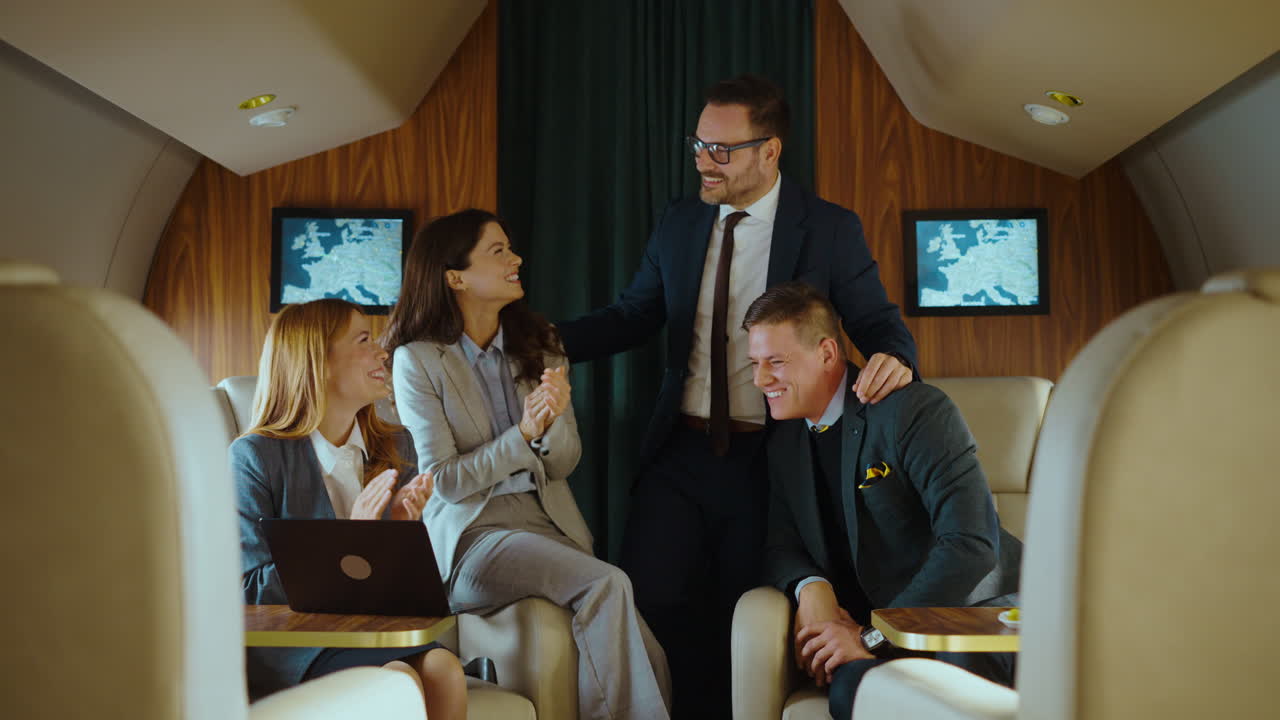 Businesspeople Celebrating in Private Jet