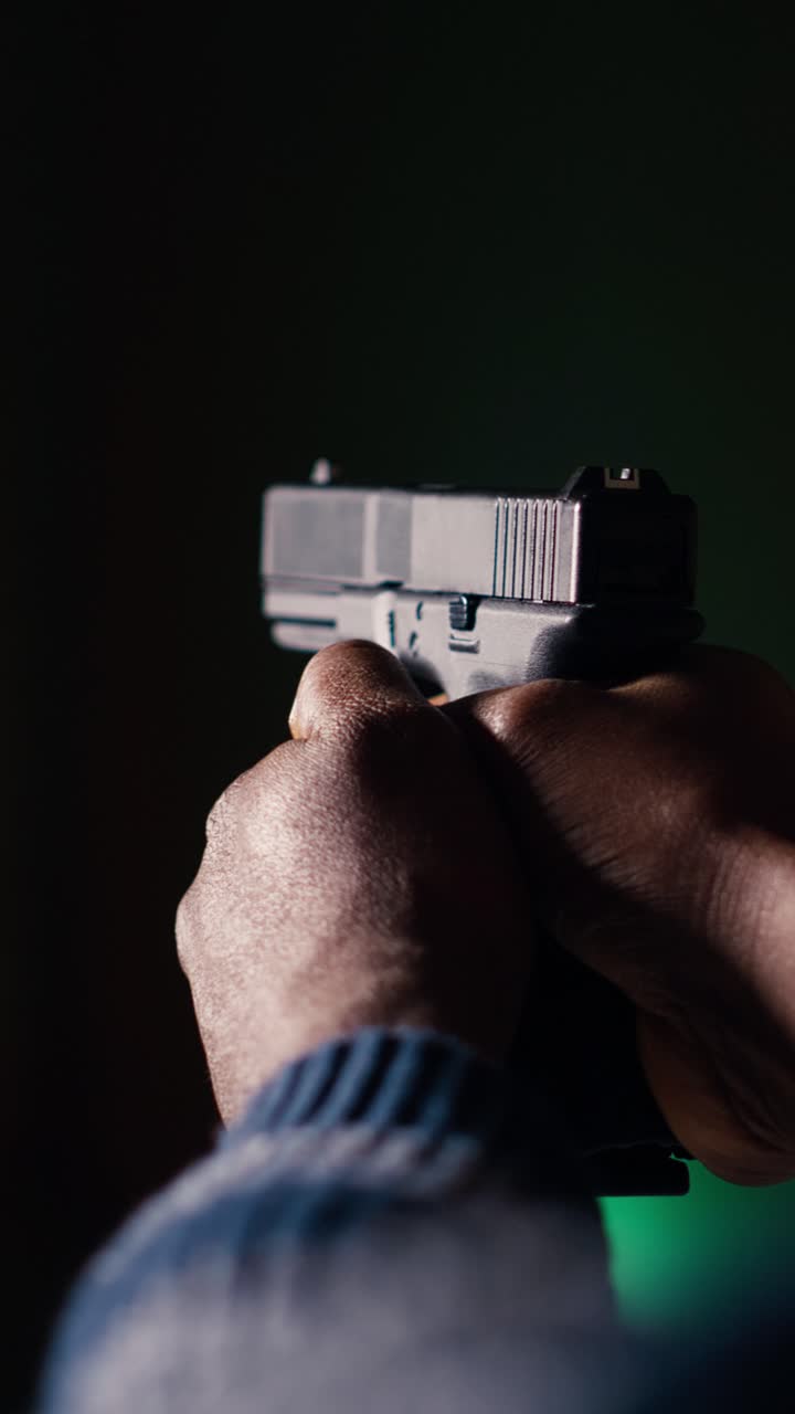 Vertical video Firing range customer checking if he shot bullseye