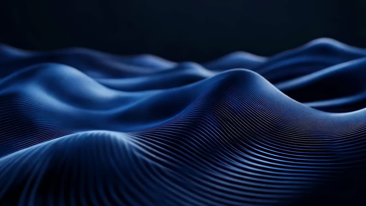 Abstract video of smooth, dark blue waves with a low-angle view, creating a futuristic and serene