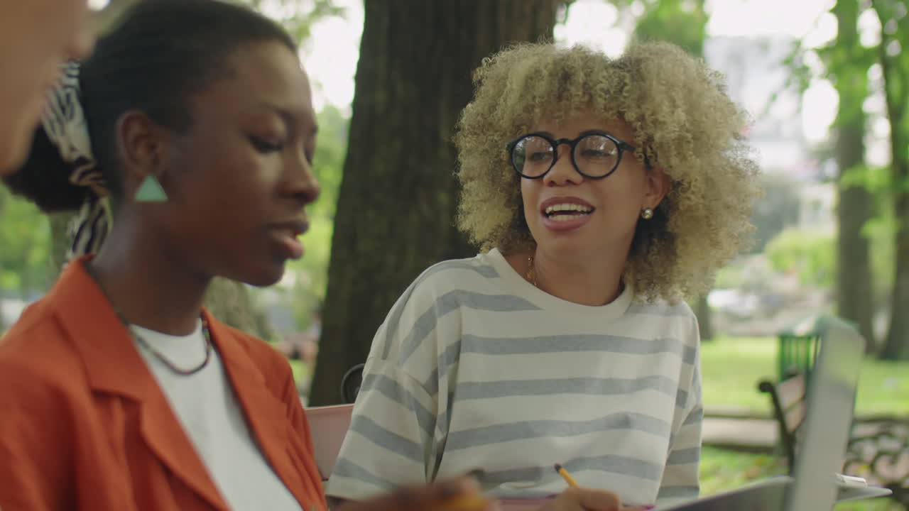 College Girl Talking with Friends in Park