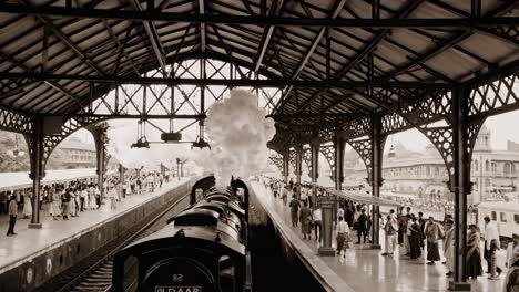 vintage video scene of a bustling train station, captured from a high angle, showcasing intricate