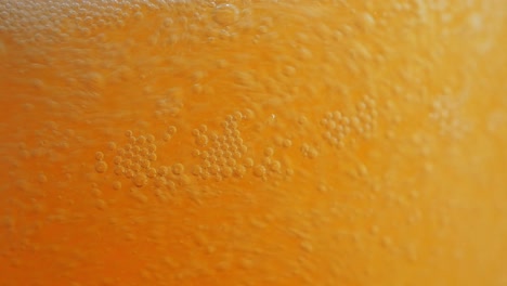 amazing closeup of a beer glass that is being filled up with more beer