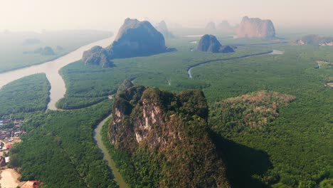 aerial drone fly above tower karst rock structures in thailand national park ao phang nga