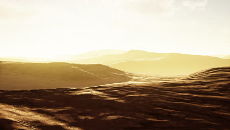 sunset over the sand dunes in the desert