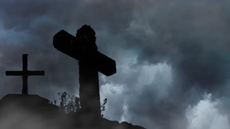 two graves with crosses on a mountain silhouette