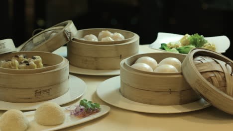 chinese dumplings served in the wooden steamers