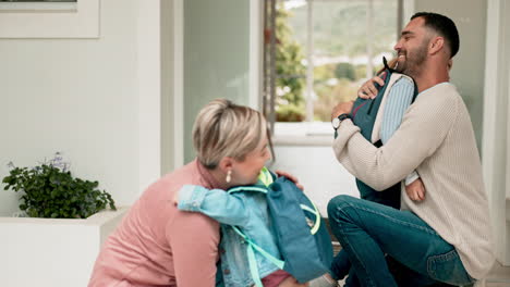 mother, father and children hug with backpack