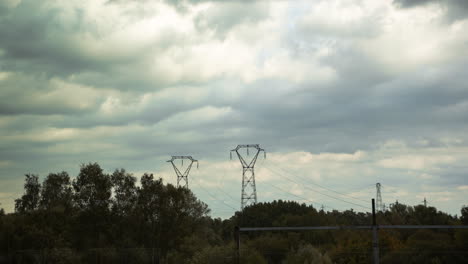 power lines and transmission towers on a cloudy day