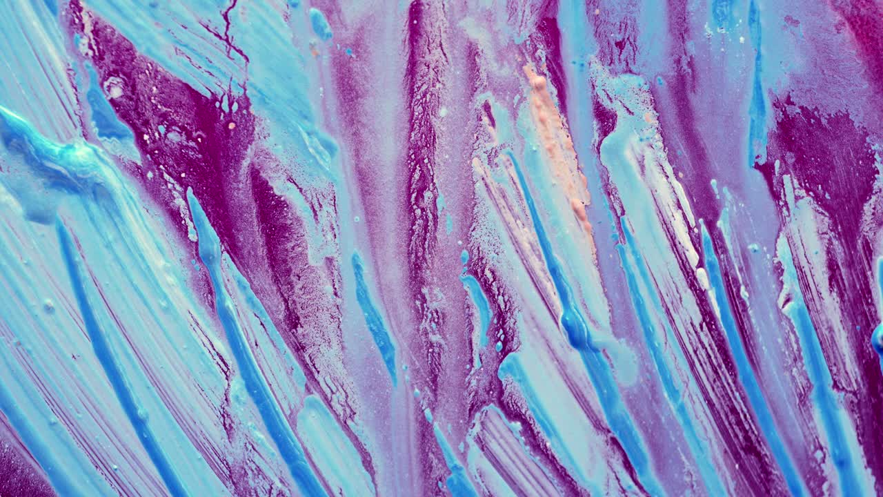 Flowing and movement of acrylic color on purple background