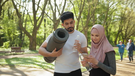 couple exercising in park