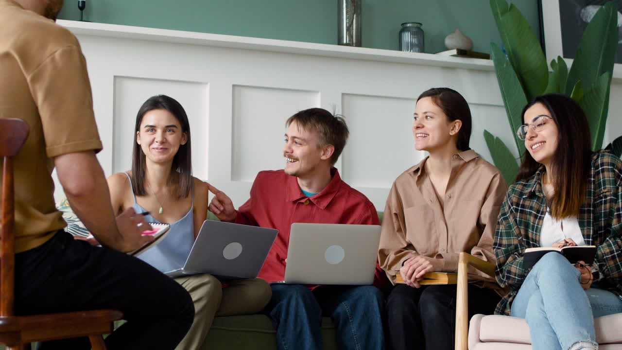 Close Up View Of Study Group Sitting On Sofa And Chairs