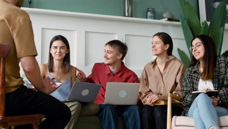 close up view of study group sitting on sofa and chairs