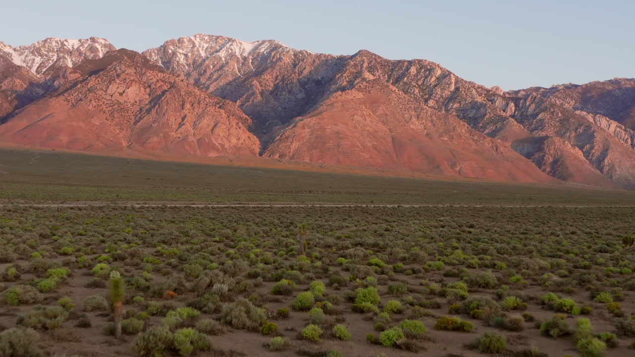 The snowy mountains of the Sierra Nevada during sunrise. Aerial shot