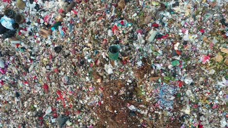 aerial view of a large landfill with waste and machinery