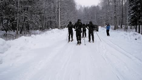 soldiers ski-touring in snowy forest