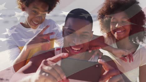 Animation-of-american-flag-over-african-american-father-and-children-taking-selfie