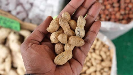 peanuts in hand at market