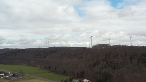 4k aerial wind turbine pan right to left