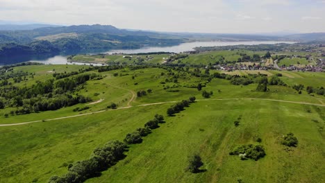 idyllic meadows by czorsztyn lake, poland on sunny summer day, aerial