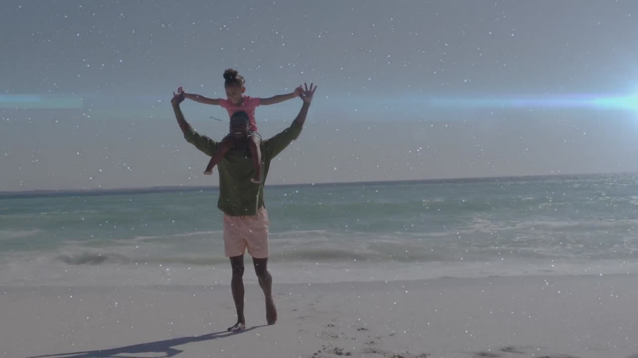 아프리카계 미국인 남성과 그의 딸이 해변에서 함께 놀고 있는 빛의 흔적 애니메이션