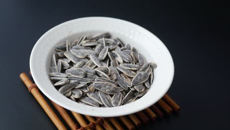 roasted sunflower seeds in a white bowl