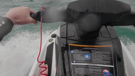 POV-shot-of-a-jet-ski-rider-getting-thrown-about-on-a-very-choppy-sea